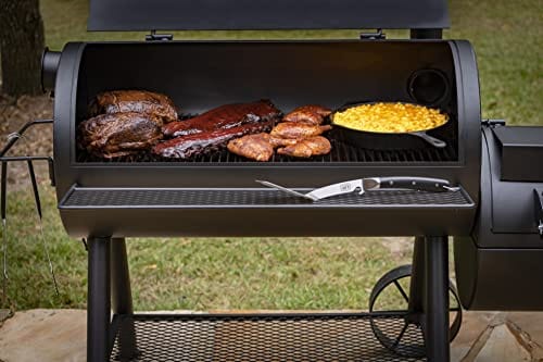 Ribs and mac and cheese cooking evenly inside an Oklahoma Joes reverse flow offset smoker