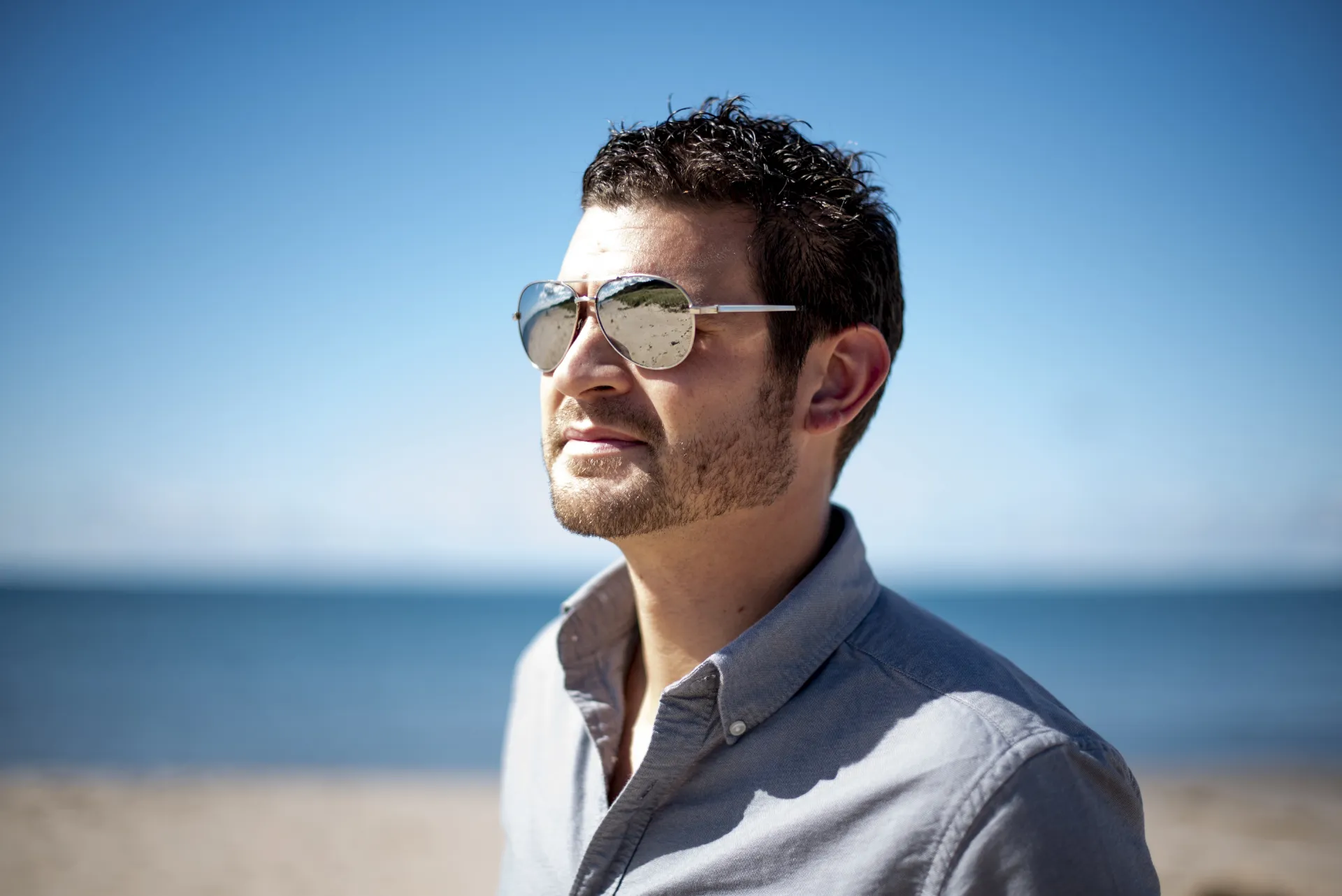 Wearing polarised sunglasses on a sunny beach