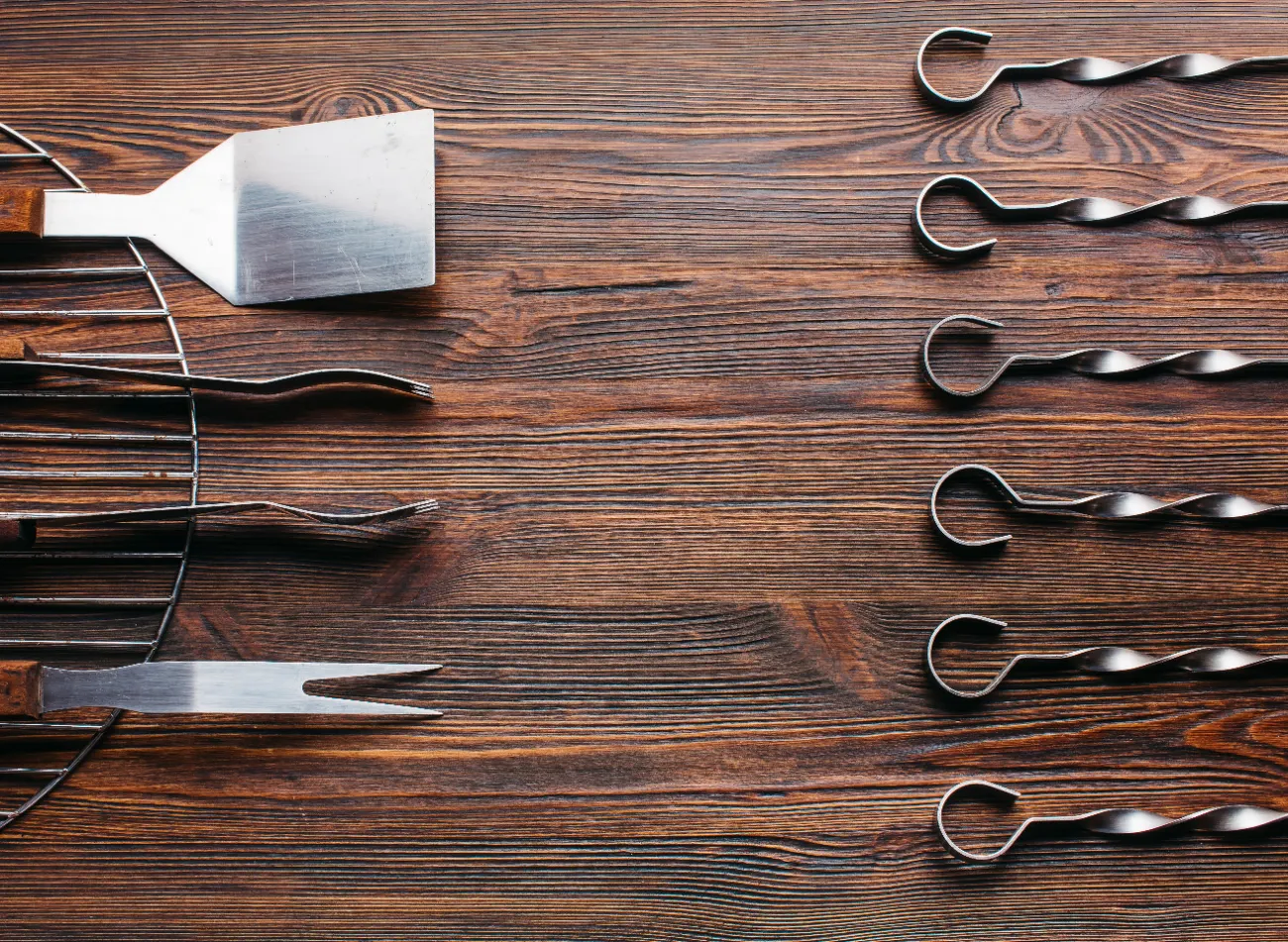 Saborr BBQ tool set laid out on a wooden table